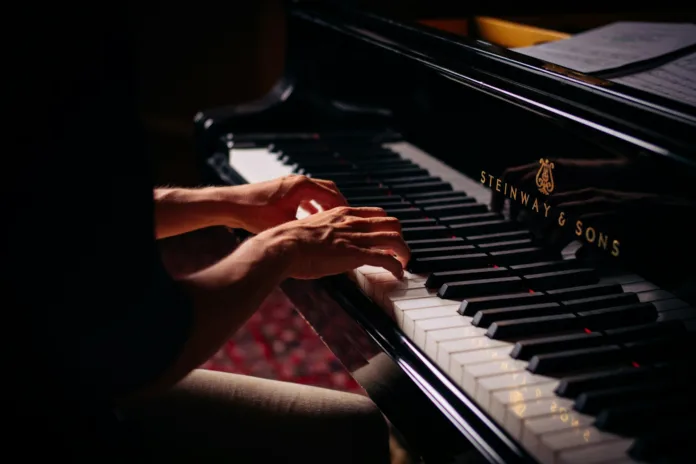 https://unsplash.com/photos/person-playing-black-upright-piano-yvEVMyTzMO4?utm_content=creditShareLink&utm_medium=referral&utm_source=unsplash